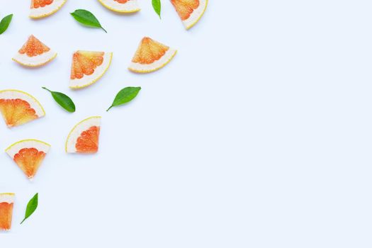 High vitamin C. Juicy grapefruit slices on white background.
