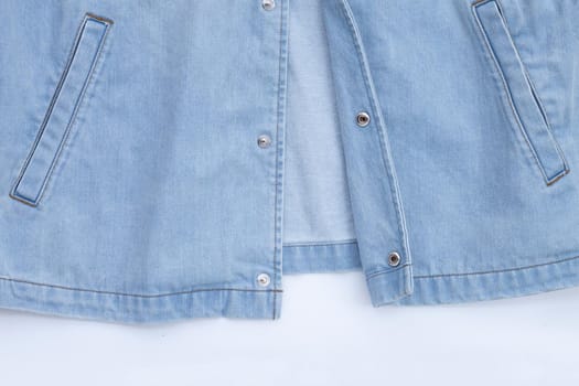 Close up jeans shirt texture on white. Copy space