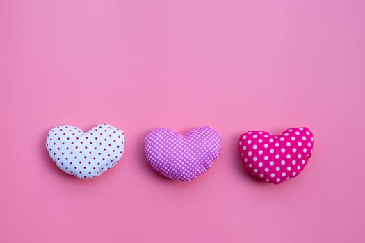 Valentine's hearts on pink background. Copy space