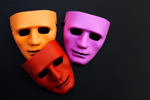 Face masks on dark background.