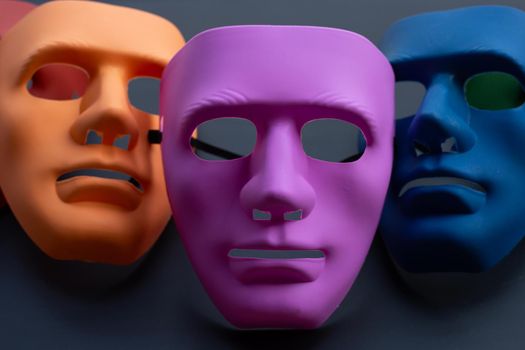 Face masks on dark background. 