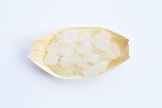 Crystal rock sugar on white background.