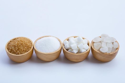 Various types of sugar on white background.