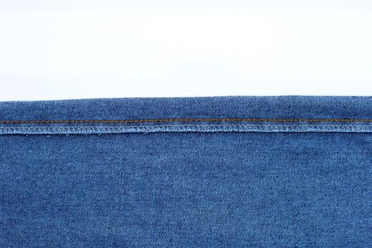 Texture of blue jeans on white background.