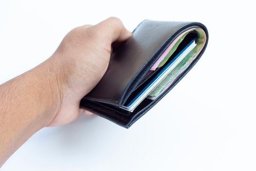 Hand holding black wallet on white background