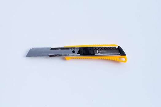 Stationery knife on white background.