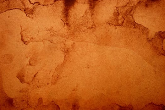 Old brown paper grunge background. Abstract liquid coffee color texture.