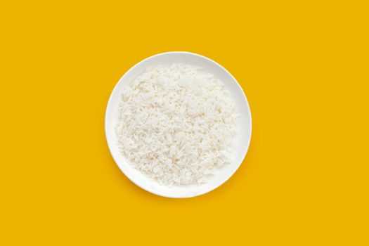 Dish of rice on yellow background. Top view