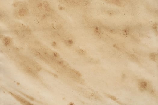 Old brown paper grunge background. Abstract liquid coffee color texture.