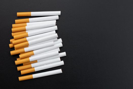 Cigarette on dark background. Non smoking for health concept