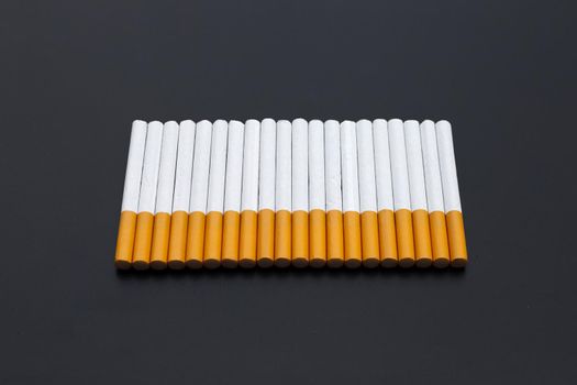Cigarette on dark background. Non smoking for health concept
