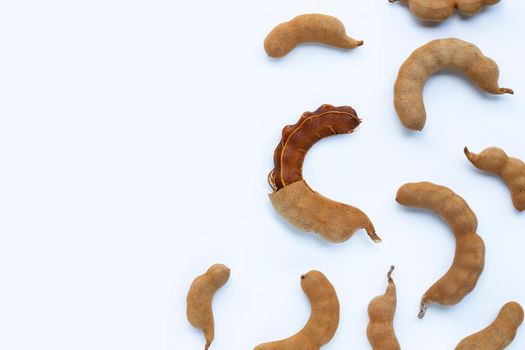 Tamarind tropical fruit on white background. Top view