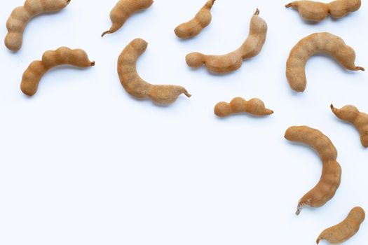 Tamarind tropical fruit on white background. Top view