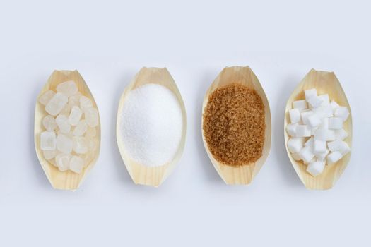 Various types of sugar on white background.