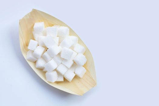 Cubes of sugar on white background. Copy space
