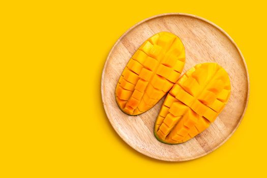 Tropical fruit, Mango  on yellow background. Top view