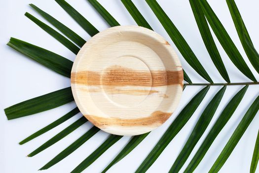 Betel palm leaf plate on white background.