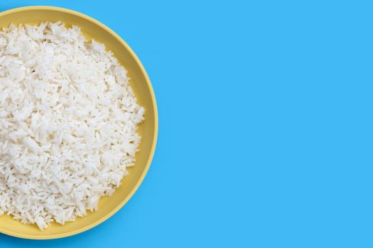 Dish of rice on blue background.
