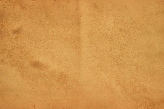 Old brown paper grunge background. Abstract liquid coffee color texture.