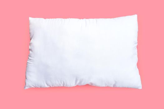 White pillow on pink background.  Top view