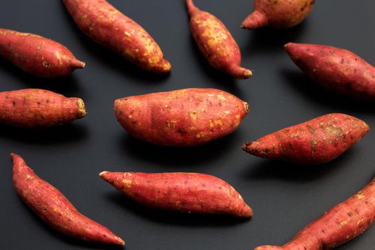 Sweet potato on dark background. 
