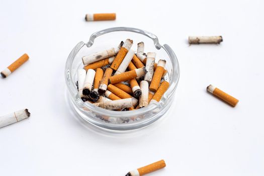 Smoked cigarettes on white background. Copy space