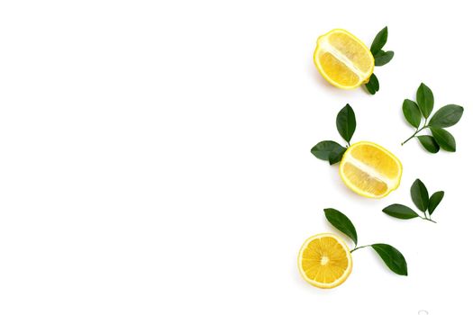 Fresh lemon with green leaves on white background.