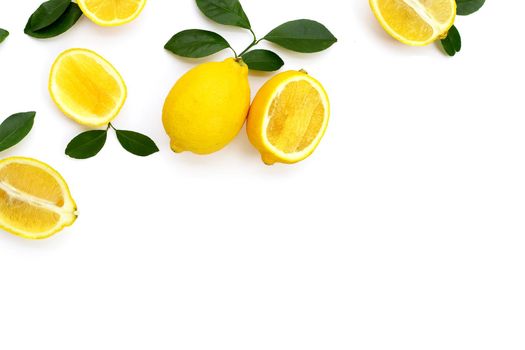 Fresh lemon with green leaves on white background.