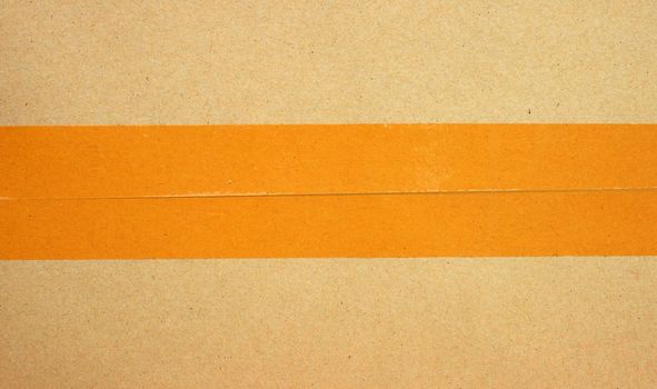 Brown cardboard box with tape 