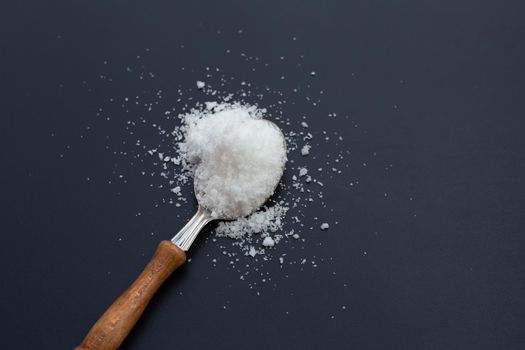 Salt on dark background. copy space
