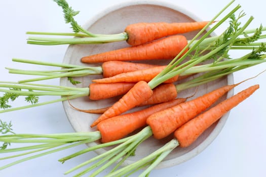 Fresh carrots on white background.