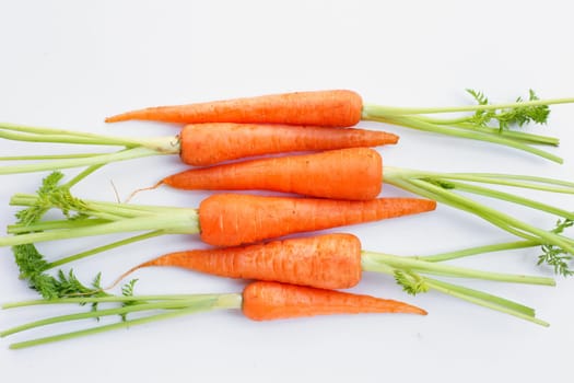 Fresh carrots on white background.