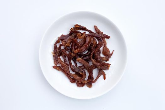Deep fried sun-dried pork on dark background