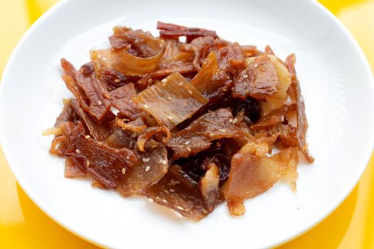 Sweet pork or pork Jerky on yellow background