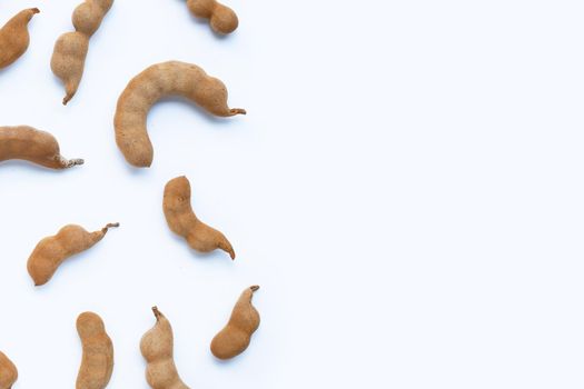 Tamarind tropical fruit on white background. Top view
