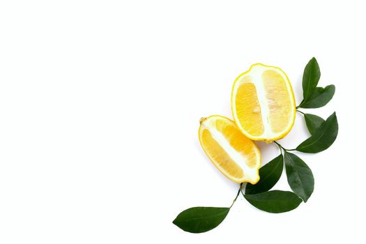 Fresh lemon with green leaves on white background.