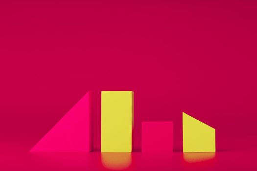 Abstract composition with copy space. Geometrical still life with pink and yellow figures against pink background.