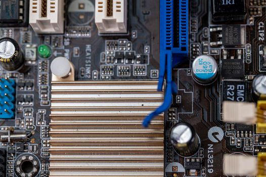 detail of a motherboard with connectors and heatsinks of a fixed computer