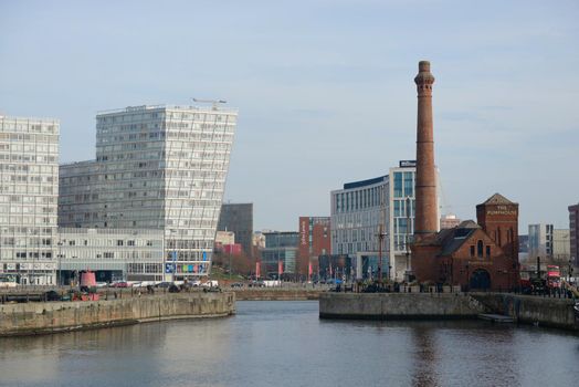 Liverpool, United Kingdom, 2nd February, 2020: The pump house and skyscrapers on the side of canning dock as part of the liverpool waterfront. Mersey