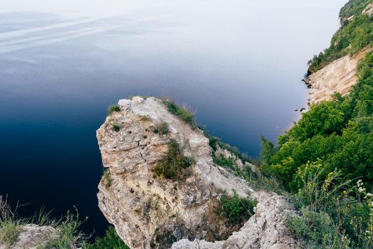 Edge of cliff with grass and flowers