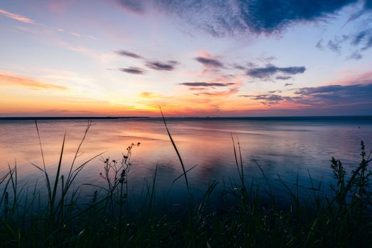 Sunrise on Volga river with reflected sky