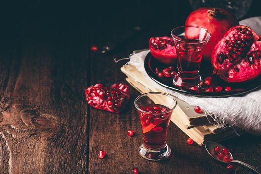 Fruit cocktail with pomegranate in shot glass