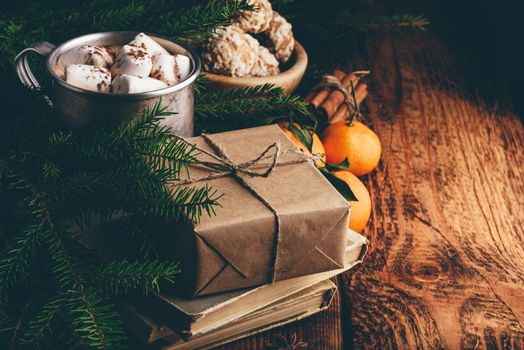 Christmas still life with hot chocolate, gift and spices