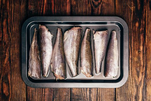 Hake carcasses on baking sheet. View from above