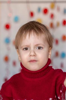 Portrait of a cute boy. Children's emotions. Christmas and new year. The concept of an advertising banner.