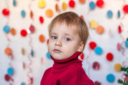 Portrait of a cute boy. Children's emotions. Christmas and new year. The concept of an advertising banner.