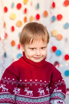 Portrait of a cute boy. Children's emotions. Christmas and new year. The concept of an advertising banner.
