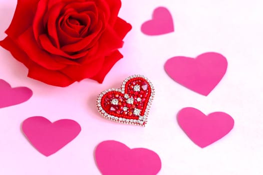 Red heart made of beads. Pink hearts. The concept of the Valentine's Day theme. A greeting card, a declaration of love. February 14  