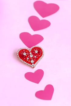 Red heart made of beads. Pink hearts. The concept of the Valentine's Day theme. A greeting card, a declaration of love. February 14 