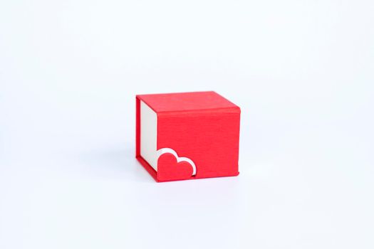 Red box for decoration with a heart on a white background. Make a Declaration of love. The concept of the Valentine's Day theme. Isolate. 